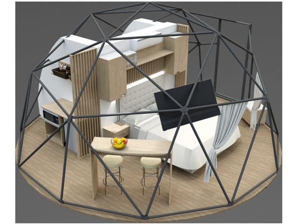 White glamping domes set in a natural landscape
