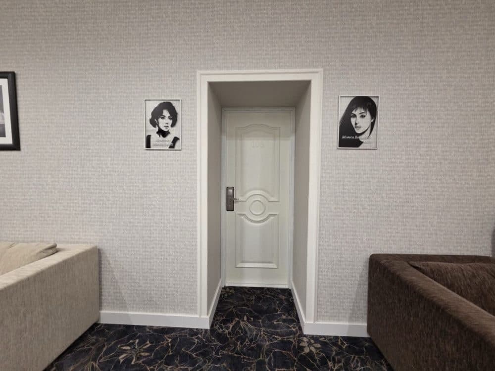 Entrance to room 106 decorated with portraits of Monica Bellucci